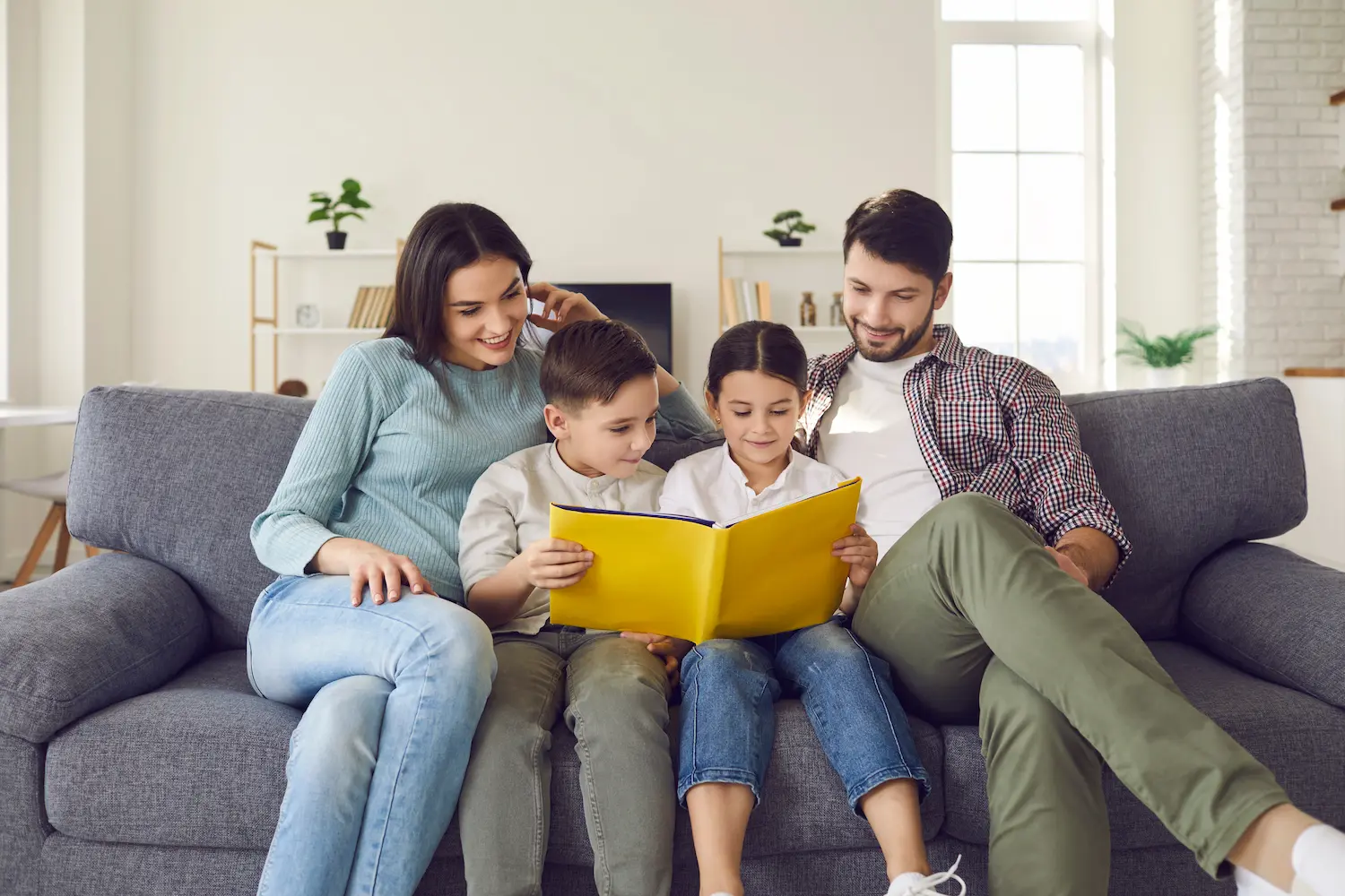 Happy family enjoying comfortable home thanks to 4 Seasons HVAC